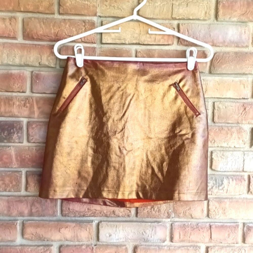 Rules of etiquette copper colored mini skirt.